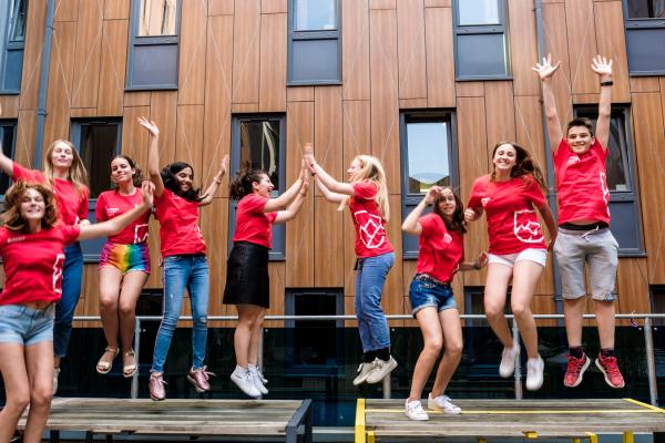 alpadia summer camps kids jumping on bench